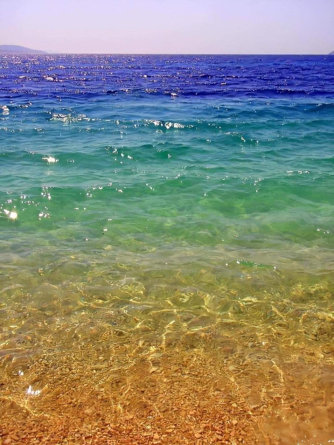A calm sea meeting an open horizon